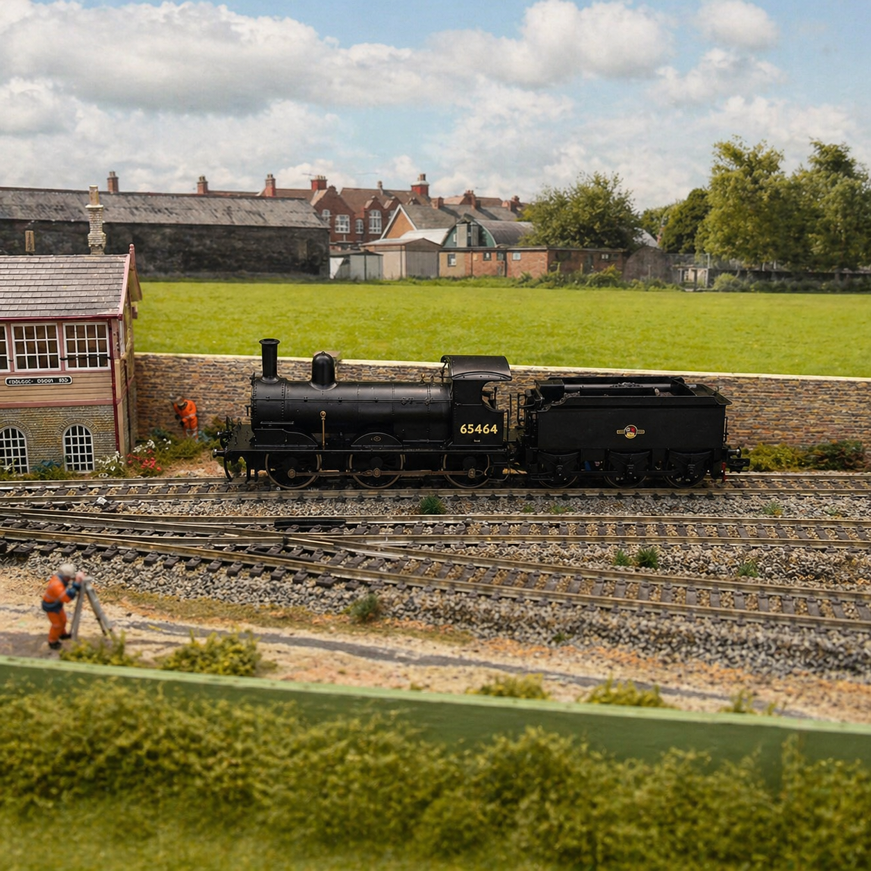 OO gauge locomotive serviced on workbench with cleaning, lubrication and performance testing