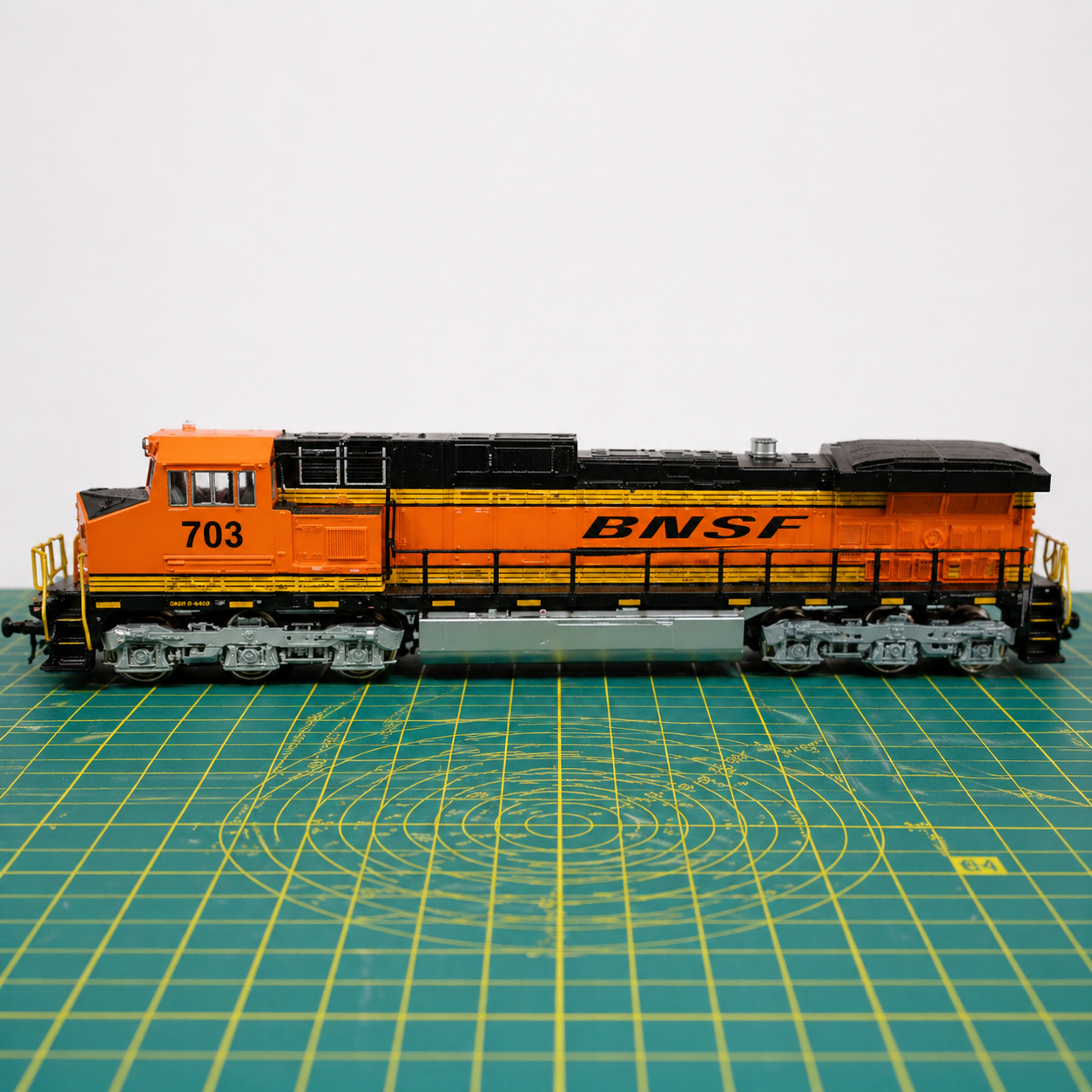 N gauge locomotive chassis undergoing repair and diagnostics on a model railway workbench