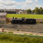OO gauge locomotive serviced on workbench with cleaning, lubrication and performance testing